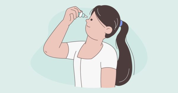女人使用眼药水的插图